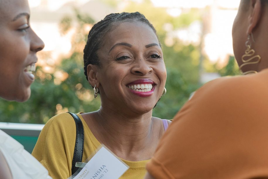 URI female alum at an event