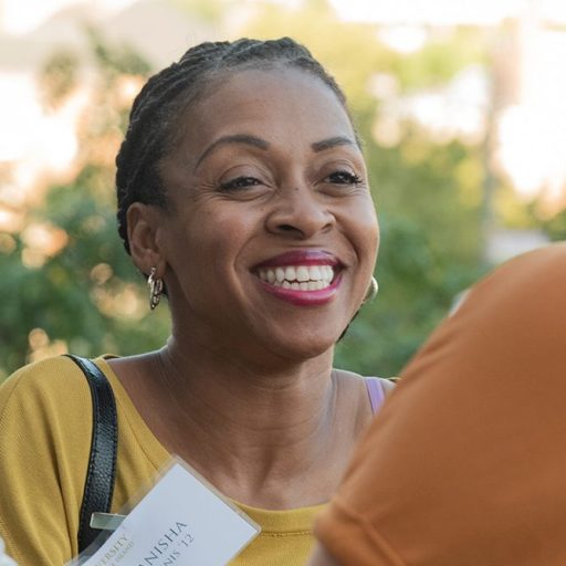 URI female alum at an event