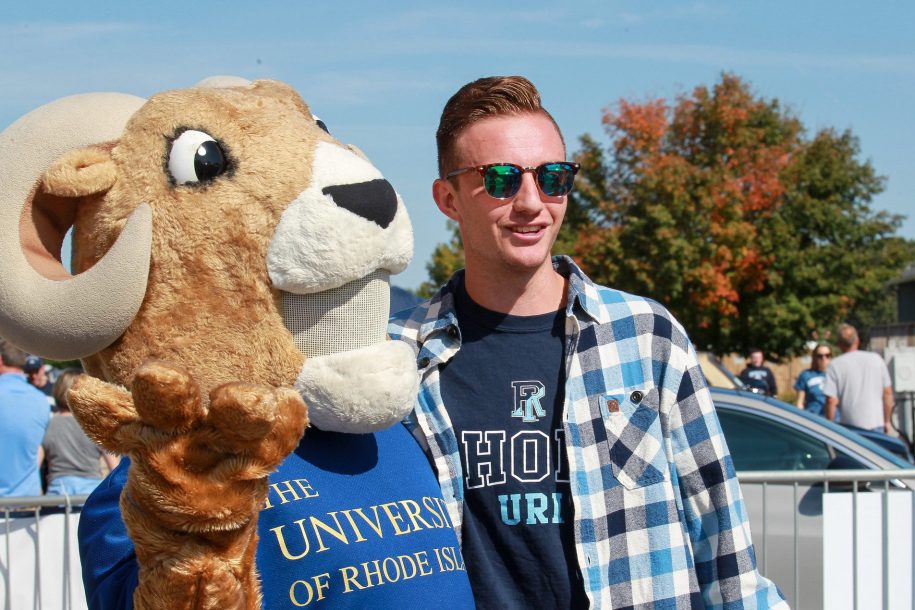Rhody with young alumni.