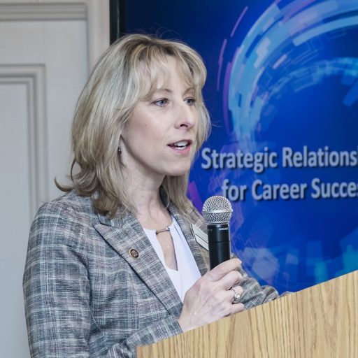 Woman at a podium for WLC event