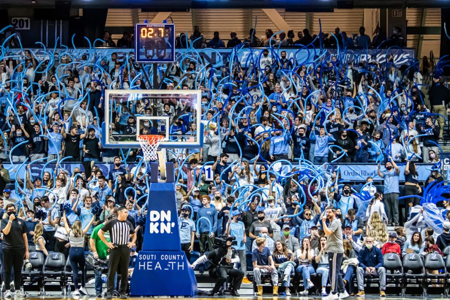 Fans cheering at a basketball game