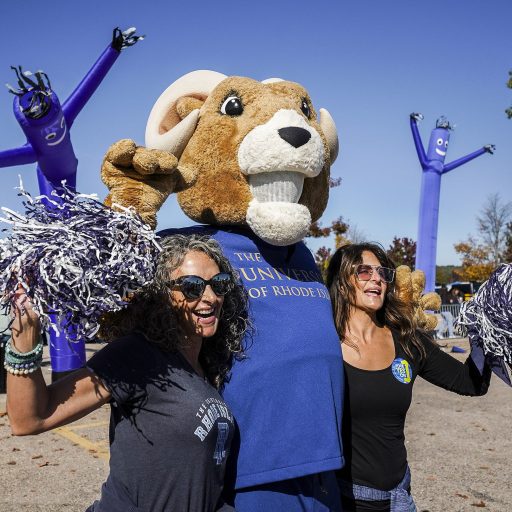 Rhody the Ram with two URI alumni.