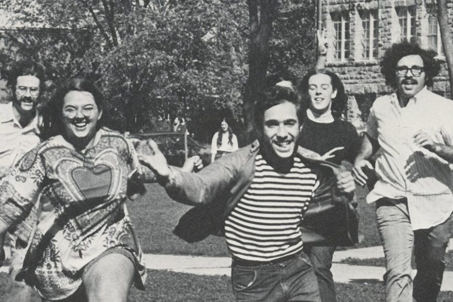 Class of 1970 running toward camera on the Quad
