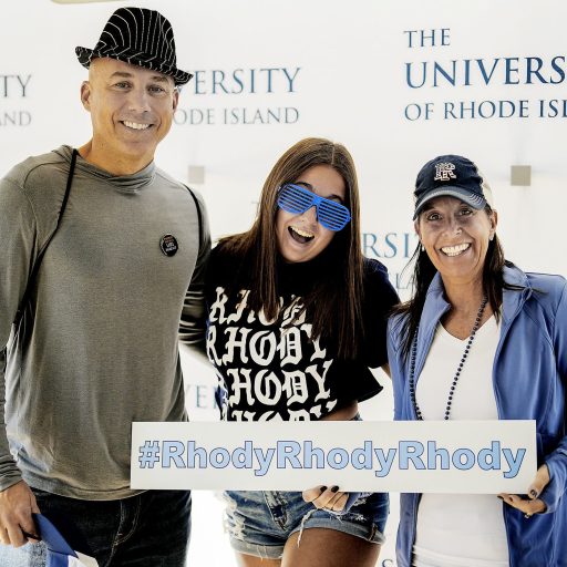 Two parents and their daughter at Alumni & Family Weekend