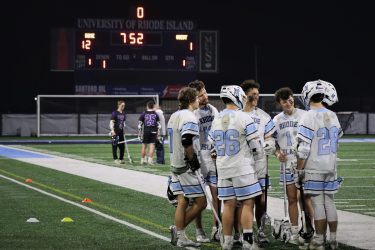 URI Men's Lacrosse team on the field.
