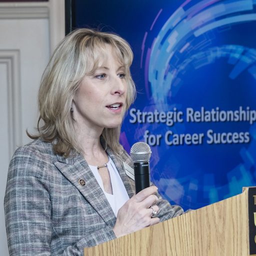 Woman at a podium for WLC event